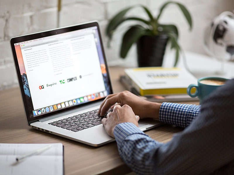 Man on computer showing business branding